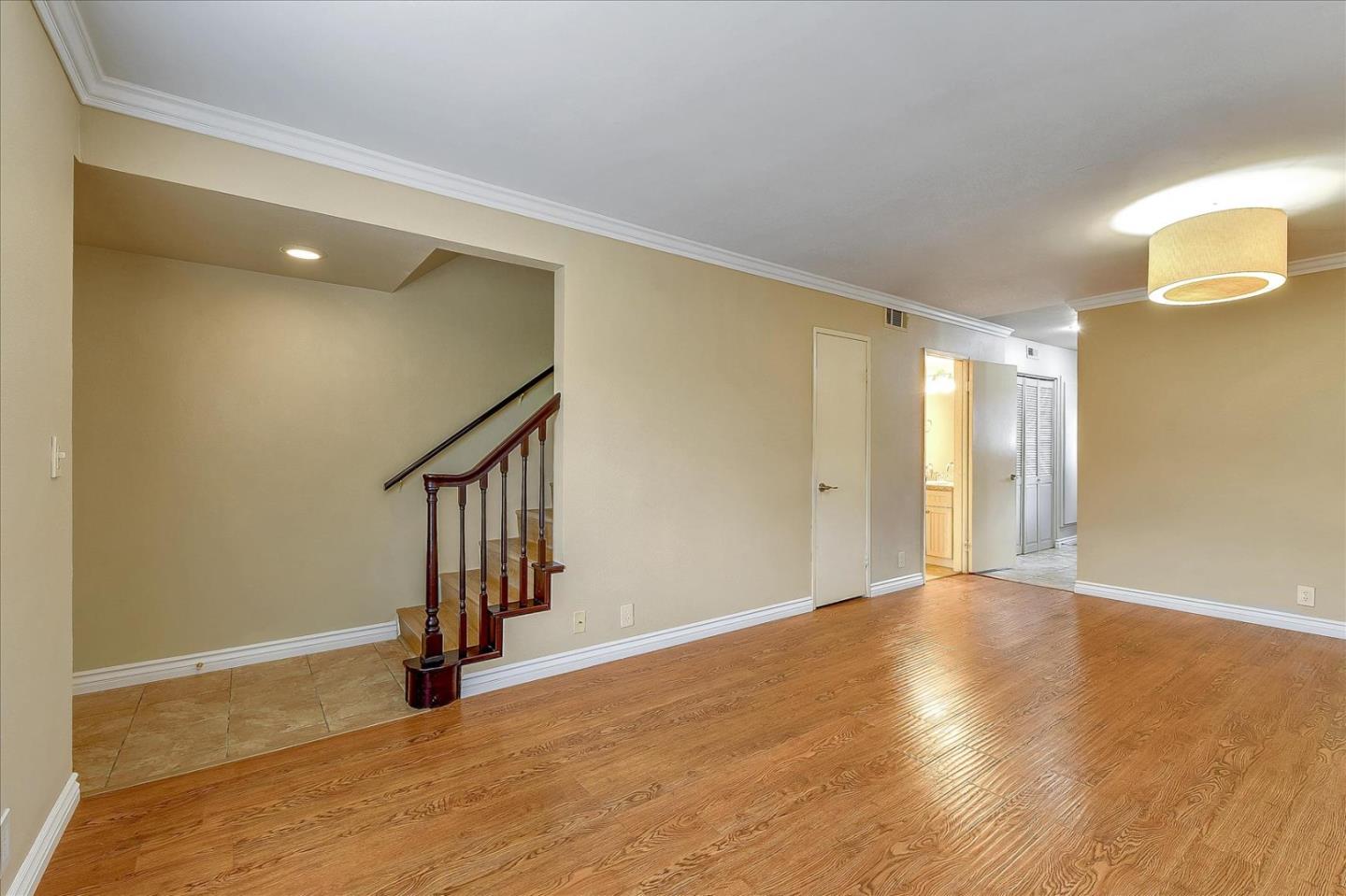 37 Harkness Avenue, Unit 2 Pasadena, CA 91106 - Photo 1 of 1 a view of an empty room with wooden floor and stairs