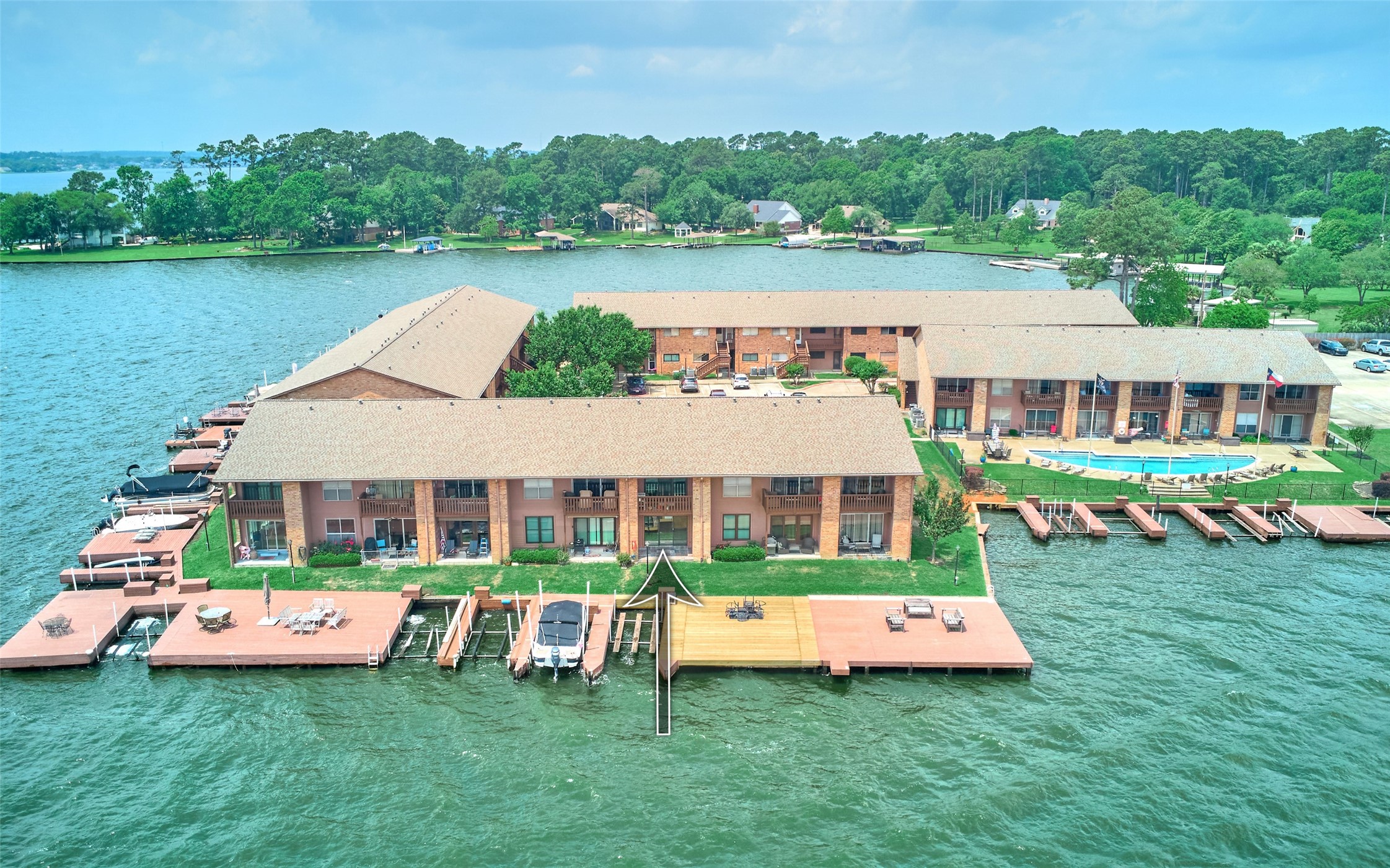 801 River Road, Unit 105D Montgomery, TX 77356 - Photo 2 of 32 Big open water views and all buildings are on the water. One of the few condo complexes that have boat slips. Complex has a pool and has a gated entry.