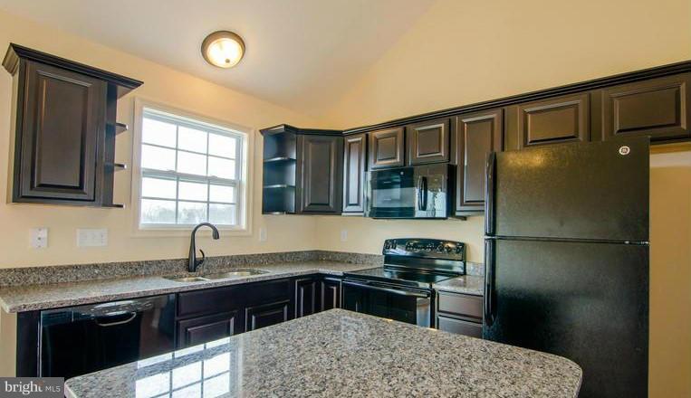 190 Gibson Road Inwood, WV 25428 - Photo 7 of 8 a kitchen with a refrigerator and a sink