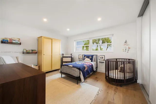 a bed room with a bed and a window