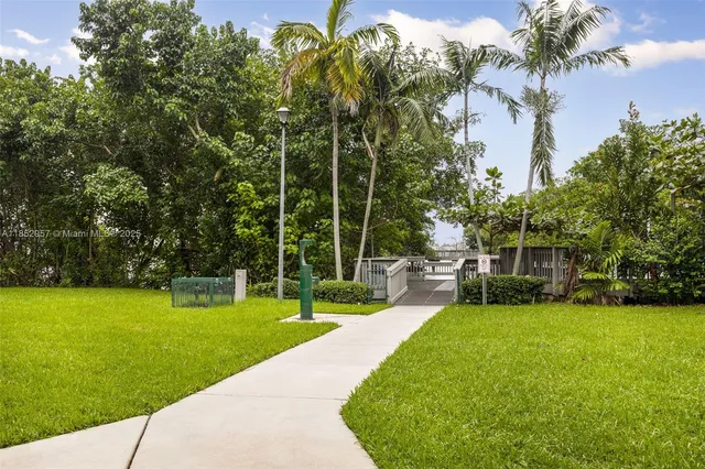 a view of balcony with wooden floor and fence