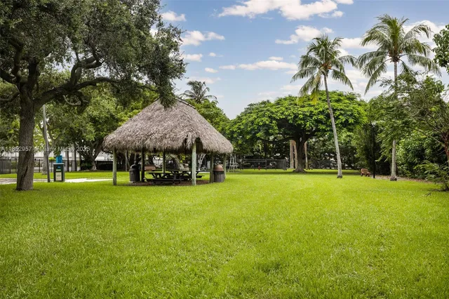 an aerial view of a house with a yard and outdoor space