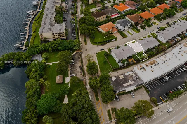 an aerial view of a house with a yard and garden