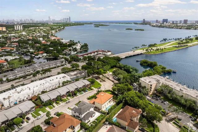 an aerial view of a city and lake view