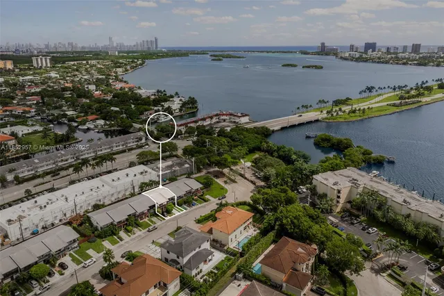 an aerial view of a house with a ocean view