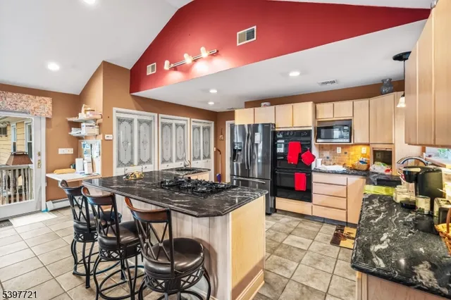 a kitchen with a table and chairs in it
