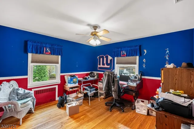 a bedroom with furniture and a window