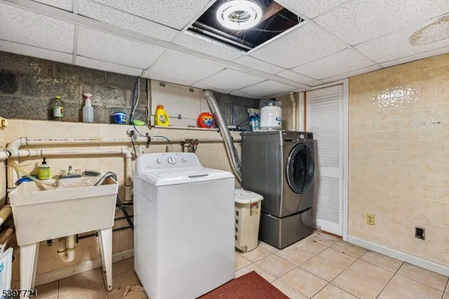 a bathroom with a sink mirror and toilet