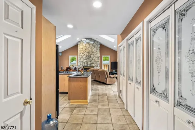 a very nice looking room with a large window and chandelier