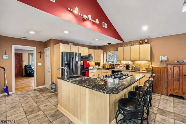 a kitchen with stainless steel appliances granite countertop counter space and cabinets