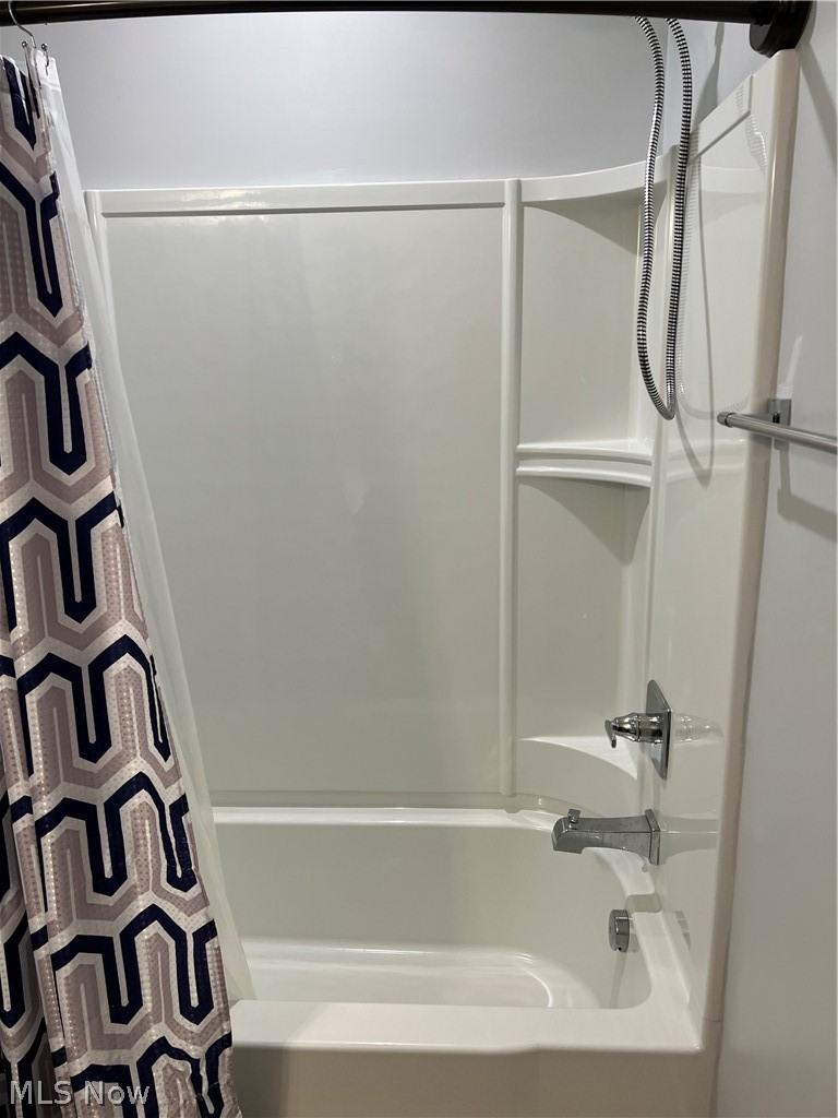 15012 Decourcey Rittman, OH 44270 - Photo 16 of 26 main Bathroom featuring shower / bathtub combination with curtain