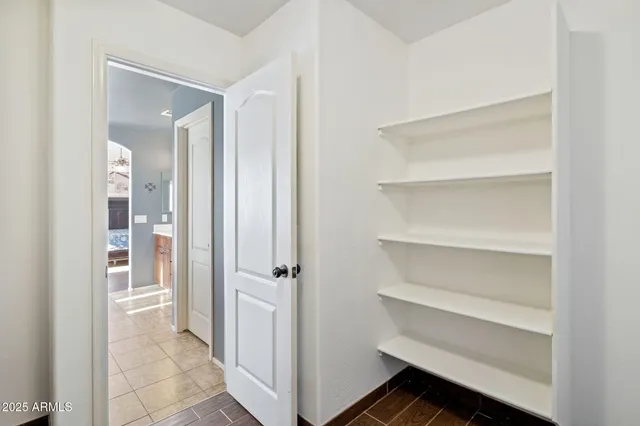 a view of a hallway with closet