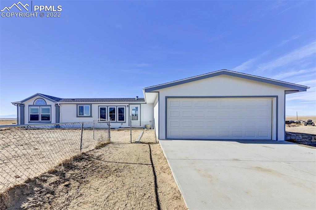 13190 South Lauppe Road Yoder, CO 80864 - Photo 1 of 38 a front view of a house with a yard