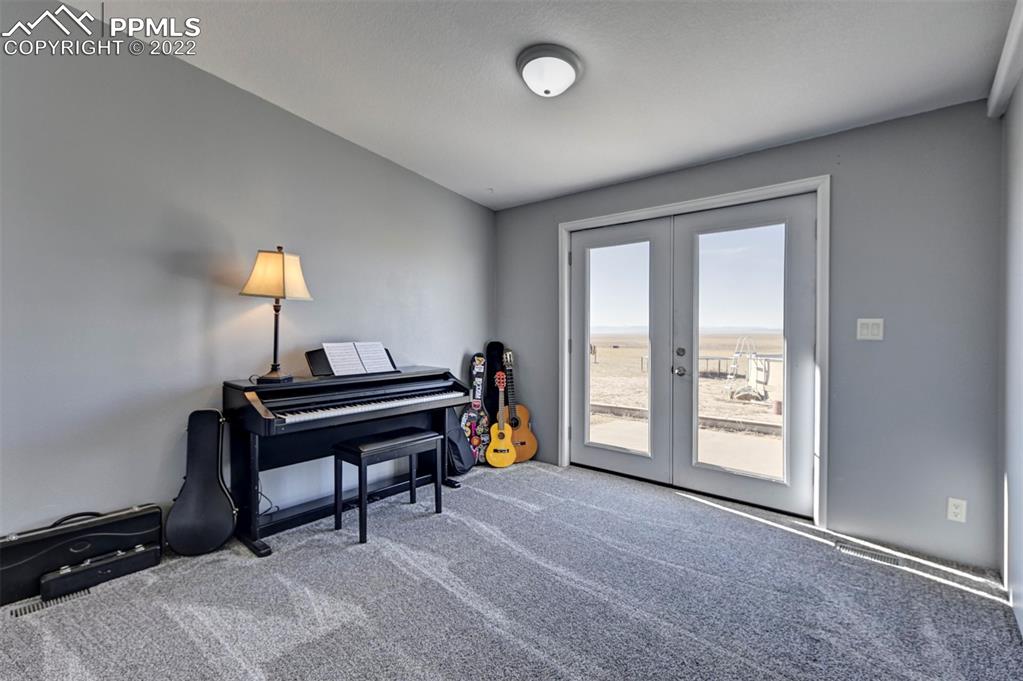 13190 South Lauppe Road Yoder, CO 80864 - Photo 13 of 38 a bedroom with furniture and a window