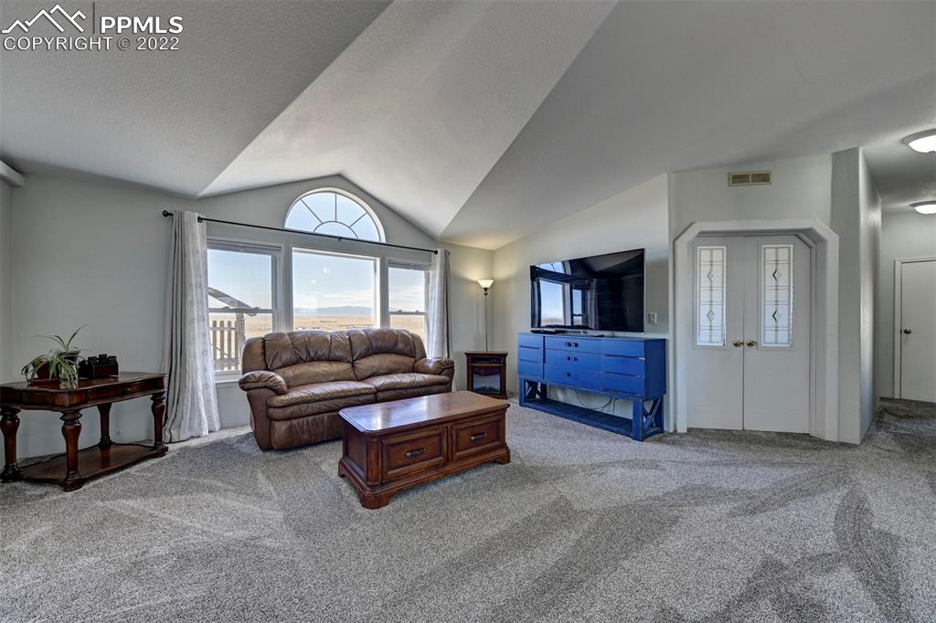 13190 South Lauppe Road Yoder, CO 80864 - Photo 17 of 38 a living room with furniture and a window