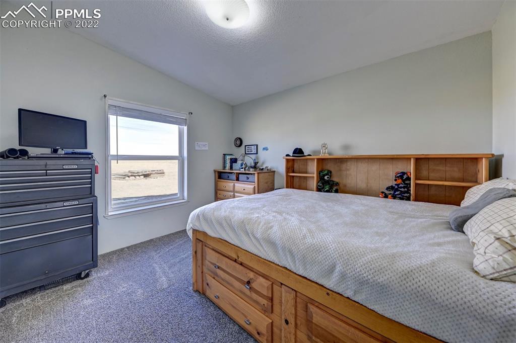 13190 South Lauppe Road Yoder, CO 80864 - Photo 27 of 38 a bed room with a bed and a window