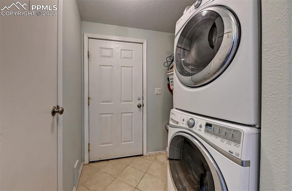 13190 South Lauppe Road Yoder, CO 80864 - Photo 31 of 38 a utility room with dryer and washer