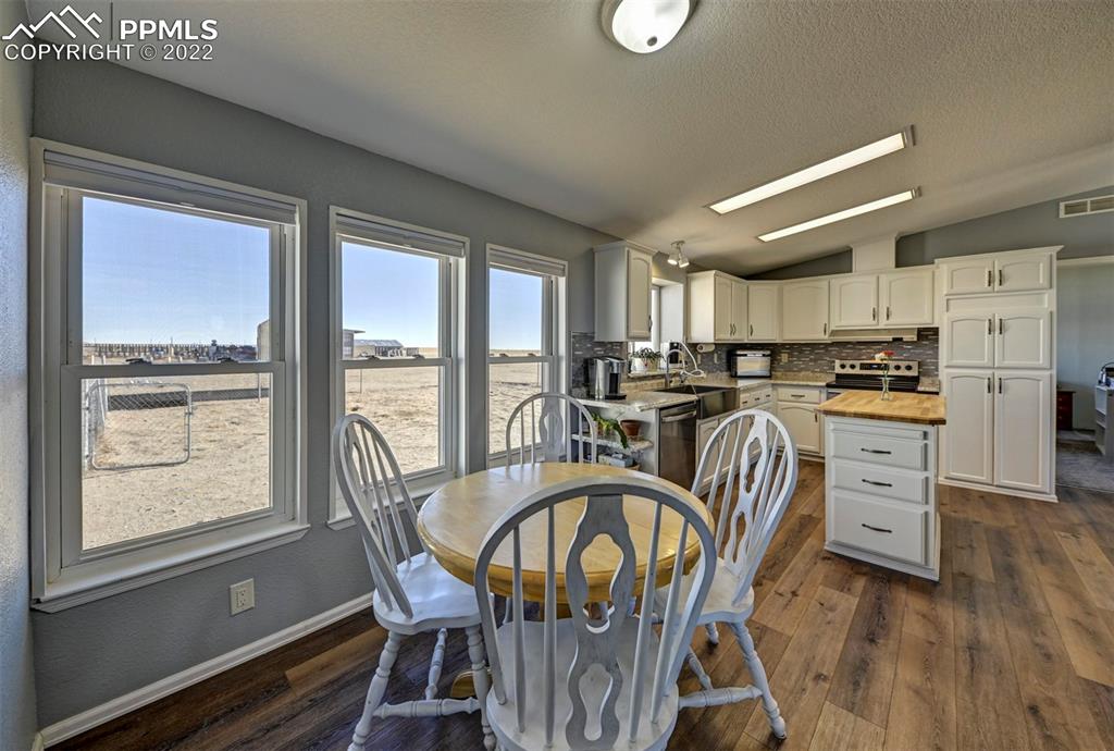 13190 South Lauppe Road Yoder, CO 80864 - Photo 4 of 38 a view of a dining room with furniture window and outside view