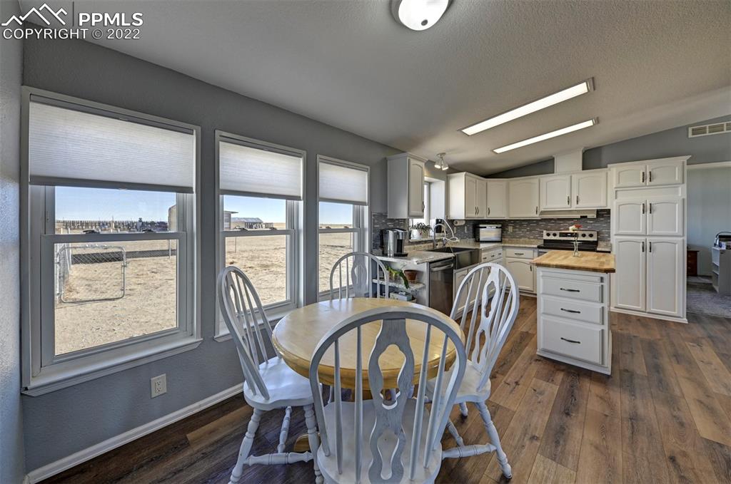 13190 South Lauppe Road Yoder, CO 80864 - Photo 5 of 38 a view of a dining room with furniture window and wooden floor