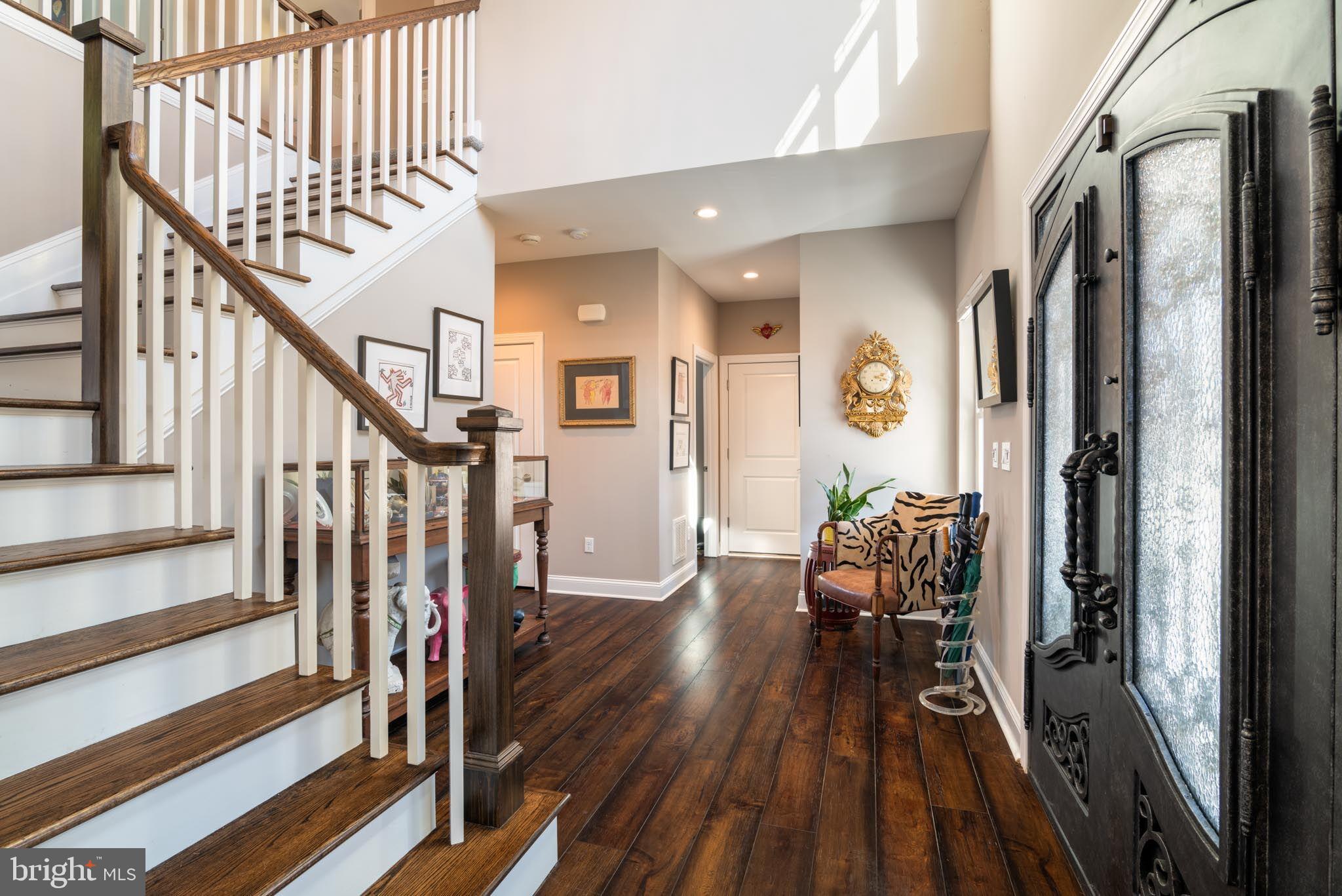 98 Alexander Drive Barnegat, NJ 08005 - Photo 12 of 60 a view of a hallway with wooden floor and staircase