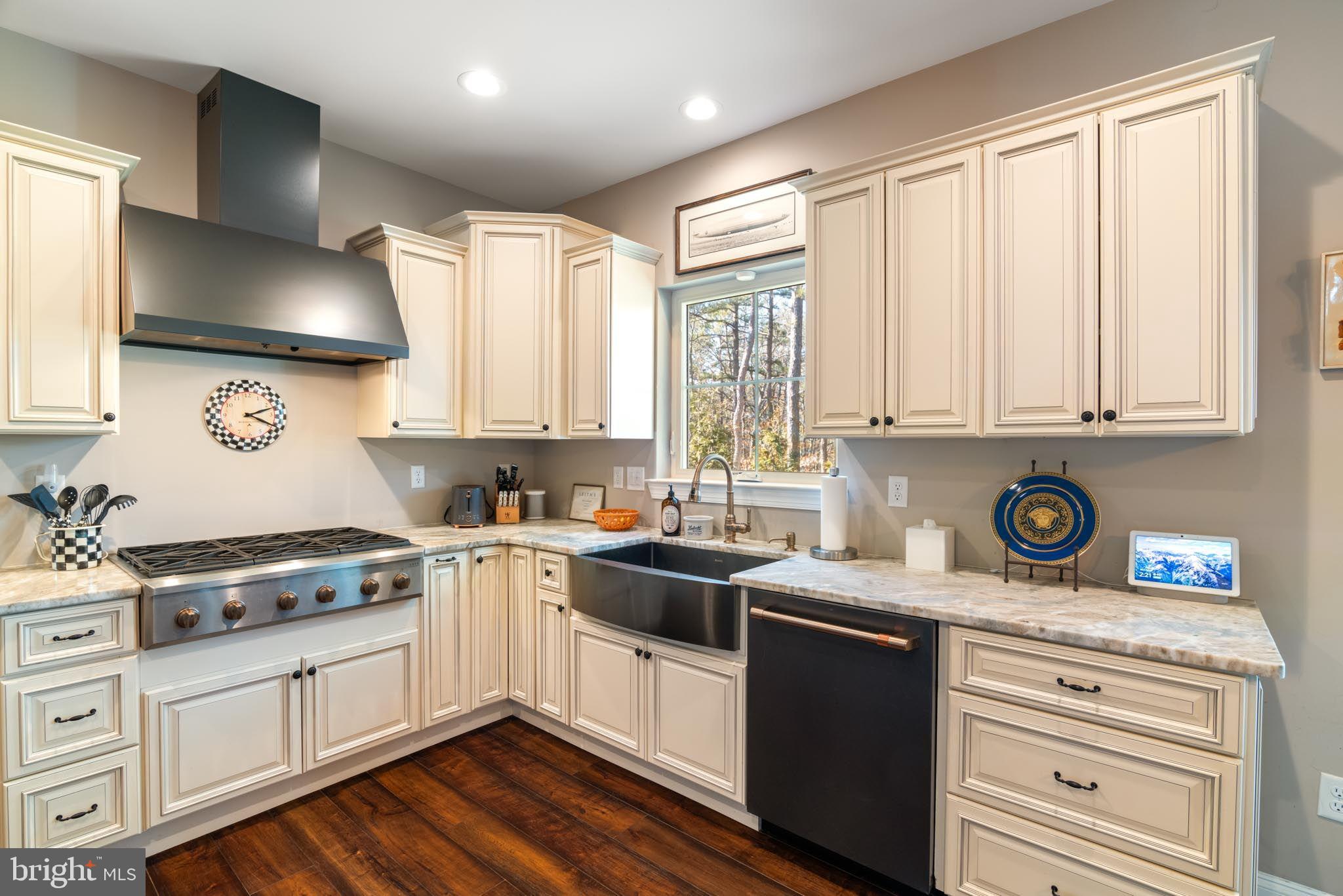 98 Alexander Drive Barnegat, NJ 08005 - Photo 15 of 60 a kitchen with granite countertop white cabinets and white appliances