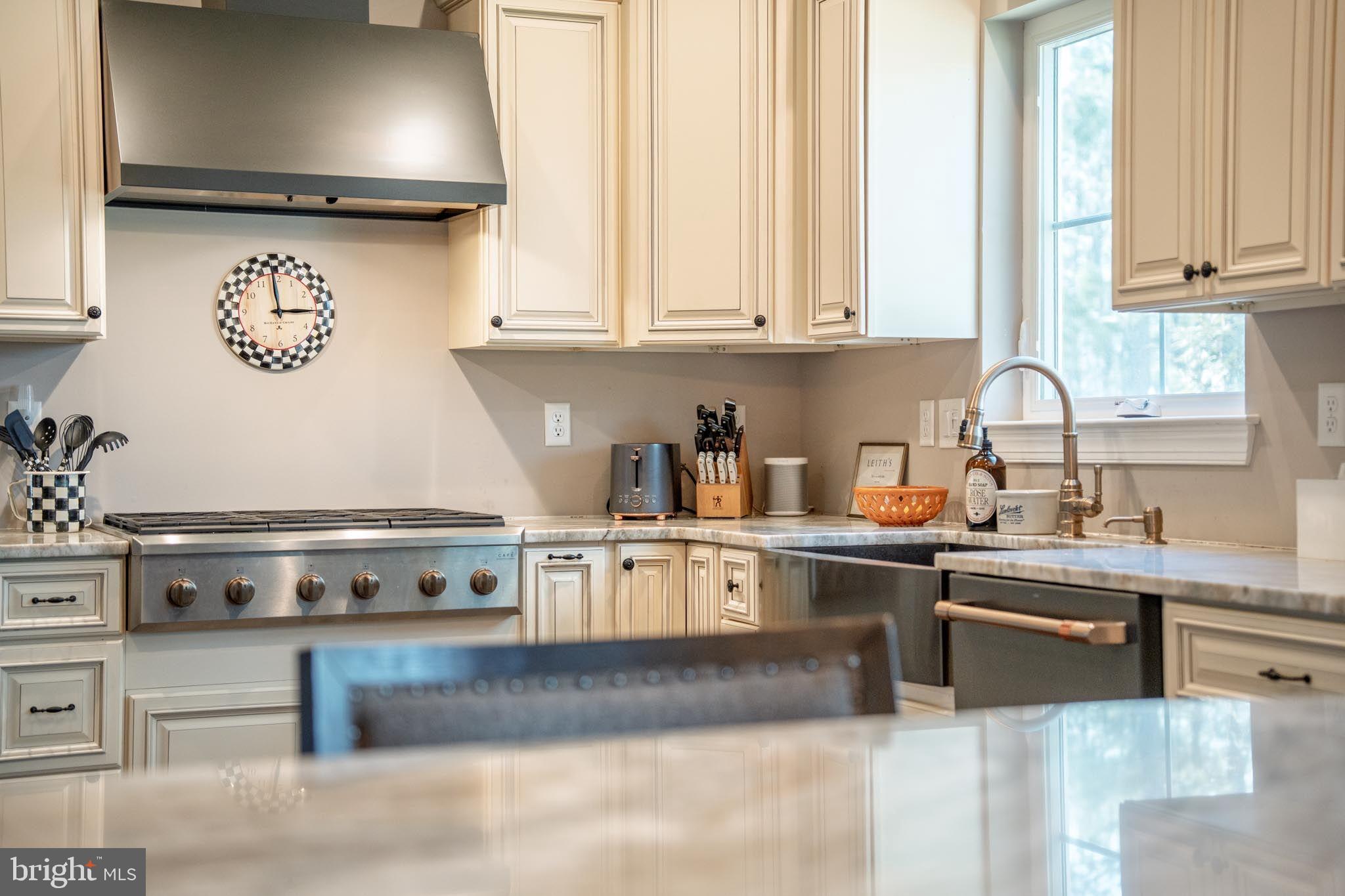 98 Alexander Drive Barnegat, NJ 08005 - Photo 20 of 60 a kitchen with stainless steel appliances granite countertop a stove a sink and a white cabinets