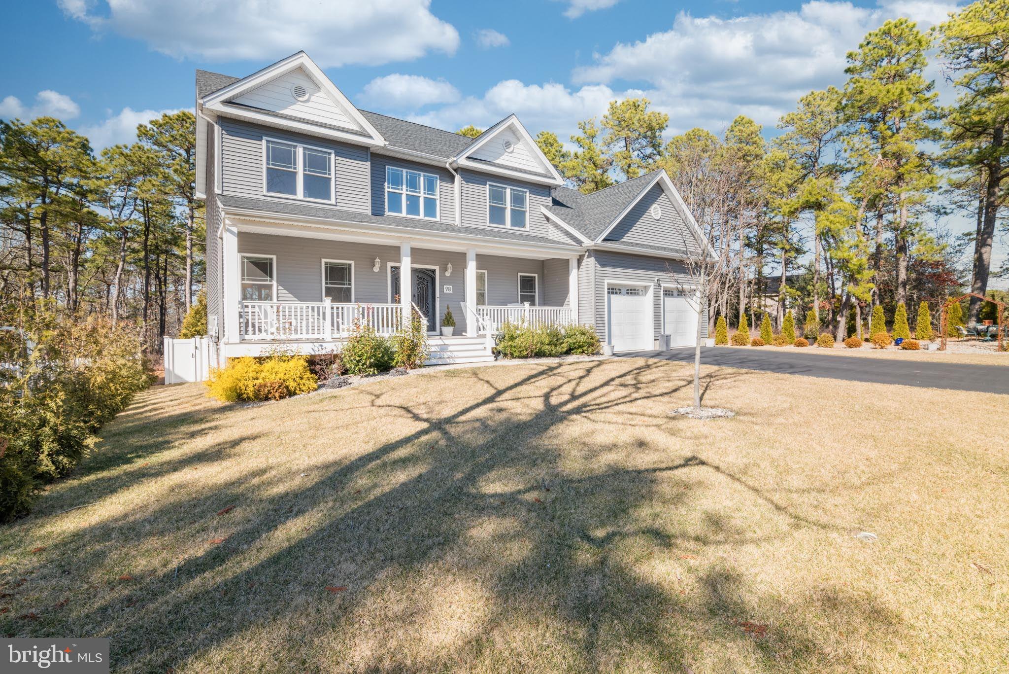 98 Alexander Drive Barnegat, NJ 08005 - Photo 2 of 60 a front view of house with yard and trees around