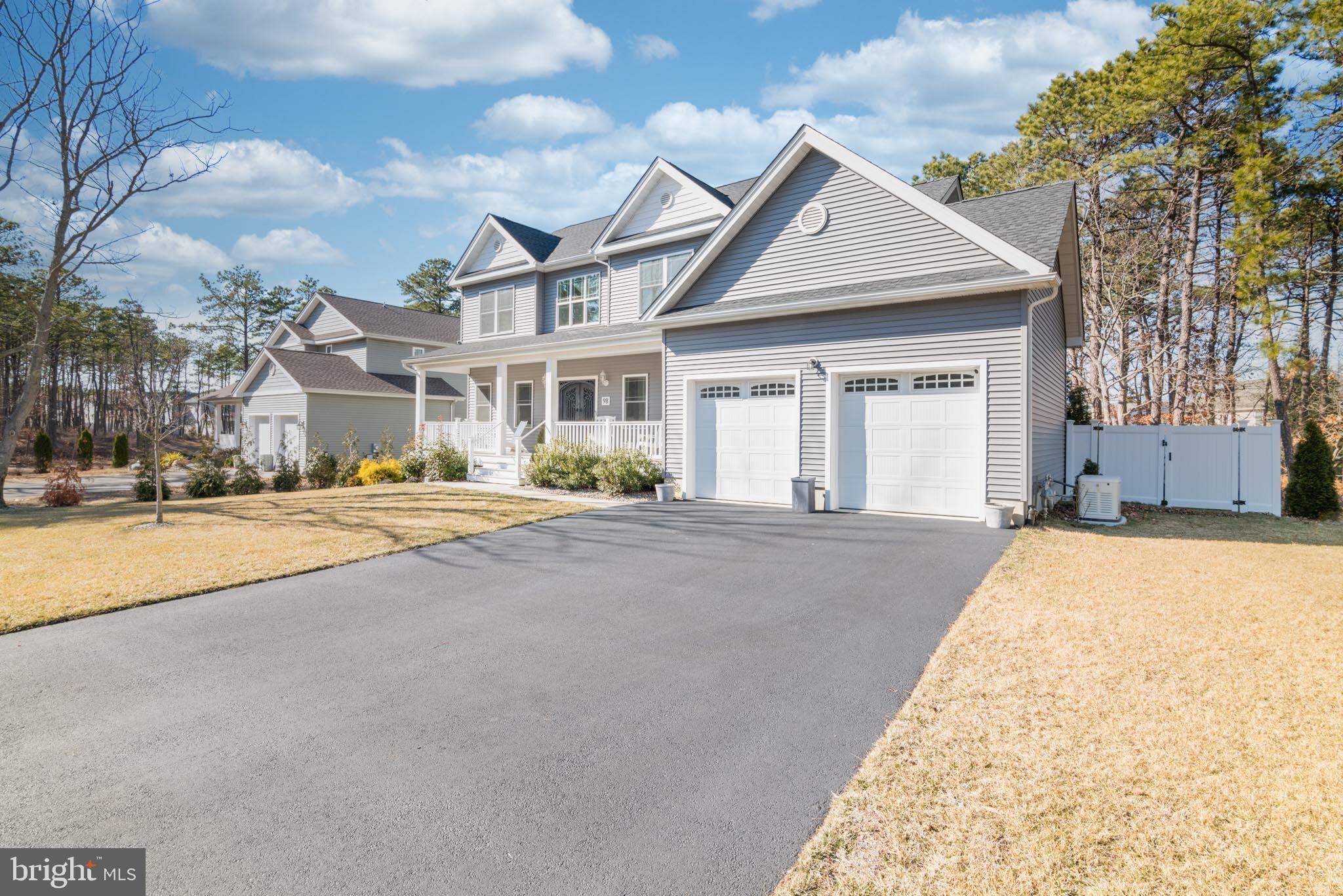98 Alexander Drive Barnegat, NJ 08005 - Photo 3 of 60 a front view of a house with a yard and garage
