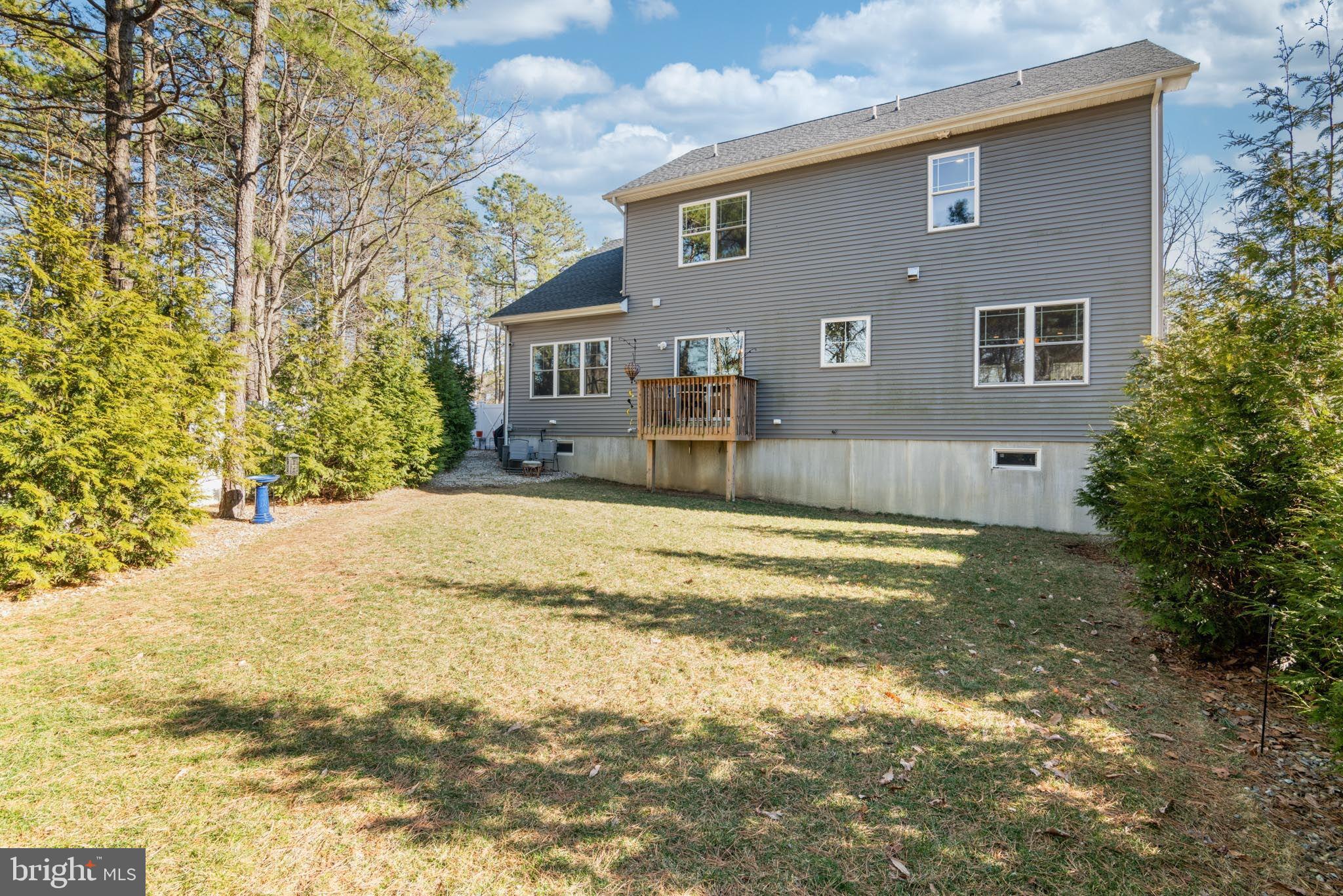 98 Alexander Drive Barnegat, NJ 08005 - Photo 58 of 60 a view of a house with a yard covered in snow