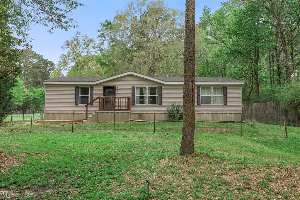 12236 Greenwood Springridge Road Keithville, LA 71047 - Photo 1 of 1 a view of a house with a yard