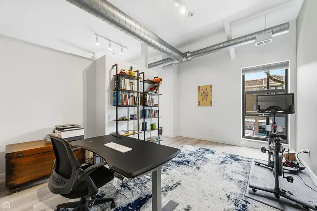 a view of a workspace with furniture