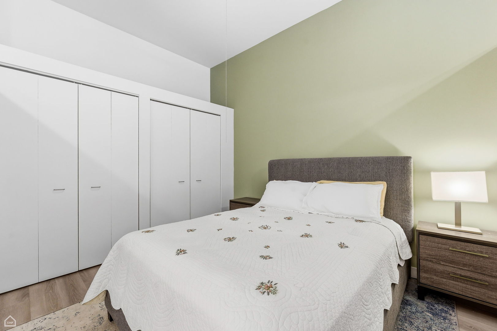 1000 East 53rd Street, Unit 215 Chicago, IL 60615 - Photo 10 of 17 a large white bed in a white room