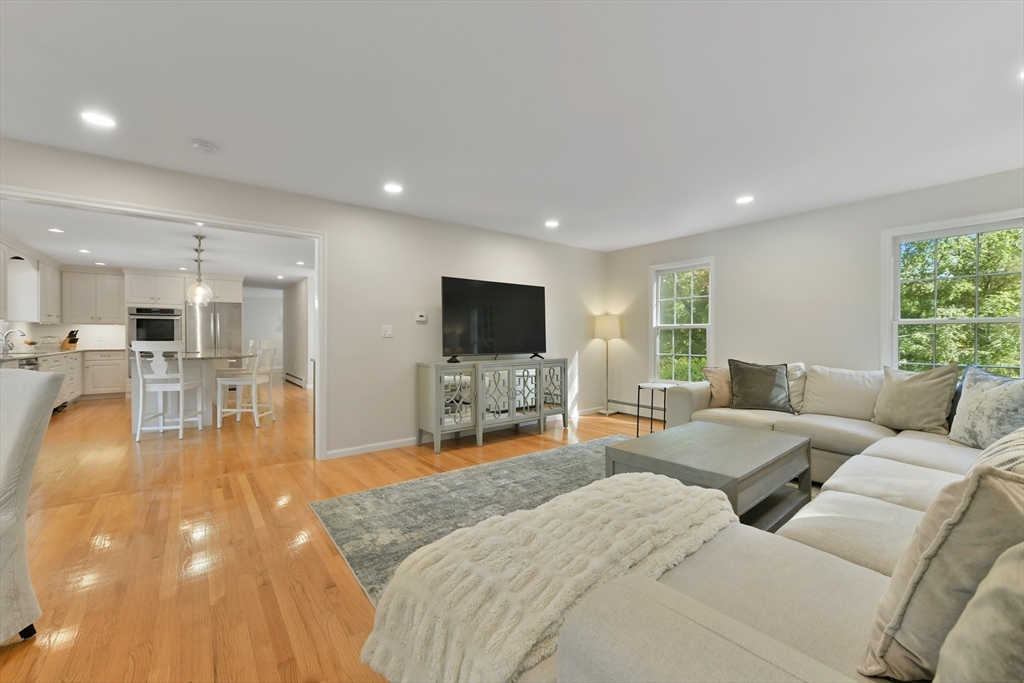 34 Valley Road Boxford, MA 01921 - Photo 11 of 42 a living room with furniture and a flat screen tv