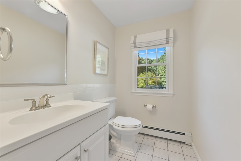 34 Valley Road Boxford, MA 01921 - Photo 18 of 42 a bathroom with a sink a toilet and a window