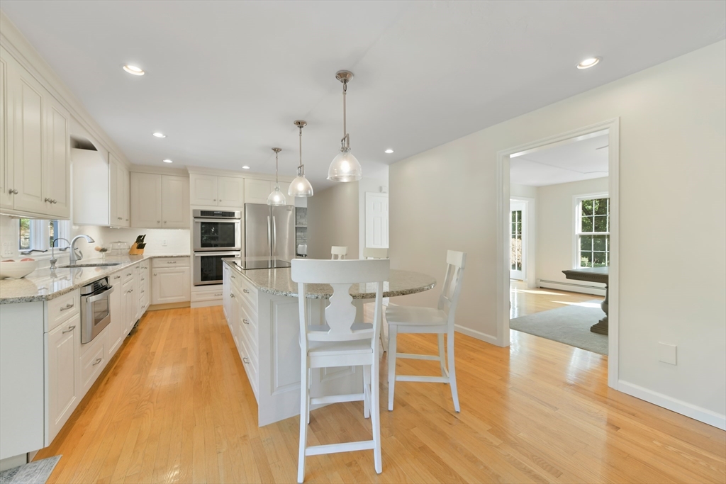 34 Valley Road Boxford, MA 01921 - Photo 2 of 42 a large kitchen with white cabinets and stainless steel appliances
