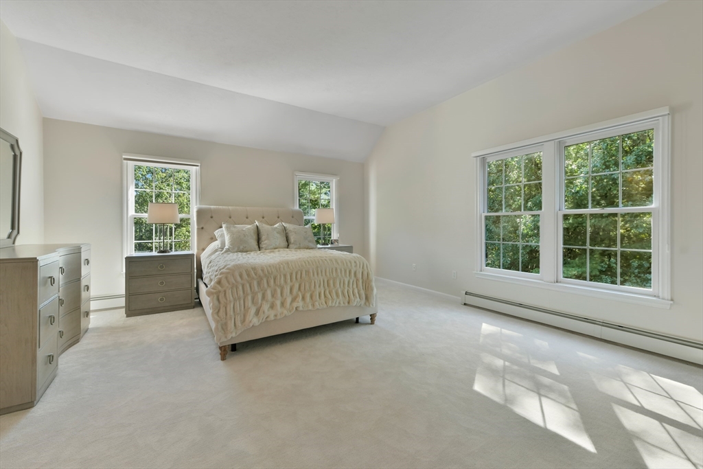 34 Valley Road Boxford, MA 01921 - Photo 29 of 42 a spacious bedroom with a bed and a window