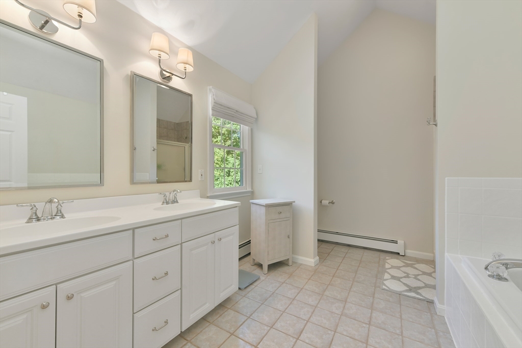 34 Valley Road Boxford, MA 01921 - Photo 30 of 42 a spacious bathroom with a double vanity sink toilet and a mirror