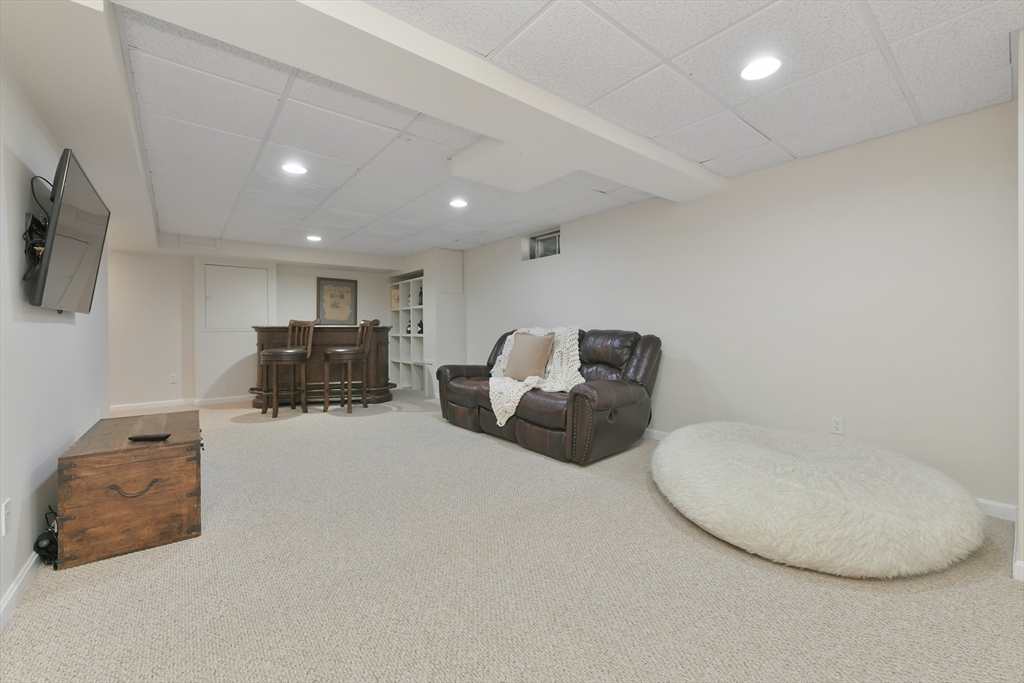 34 Valley Road Boxford, MA 01921 - Photo 33 of 42 a room with furniture and a flat screen tv