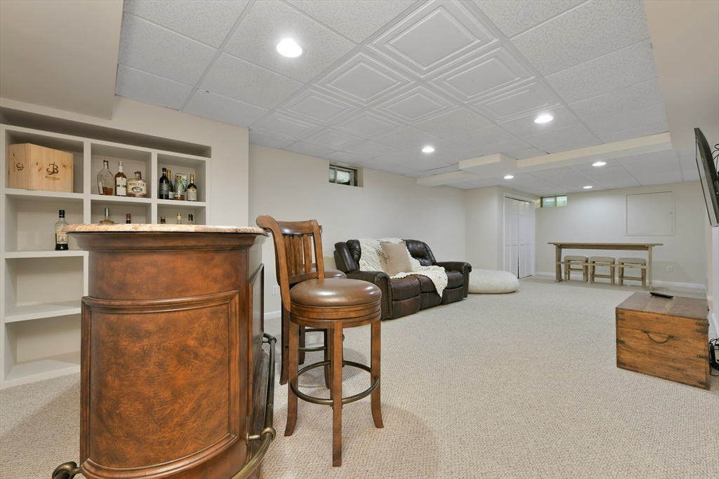 34 Valley Road Boxford, MA 01921 - Photo 34 of 42 a living room with furniture a refrigerator and kitchen