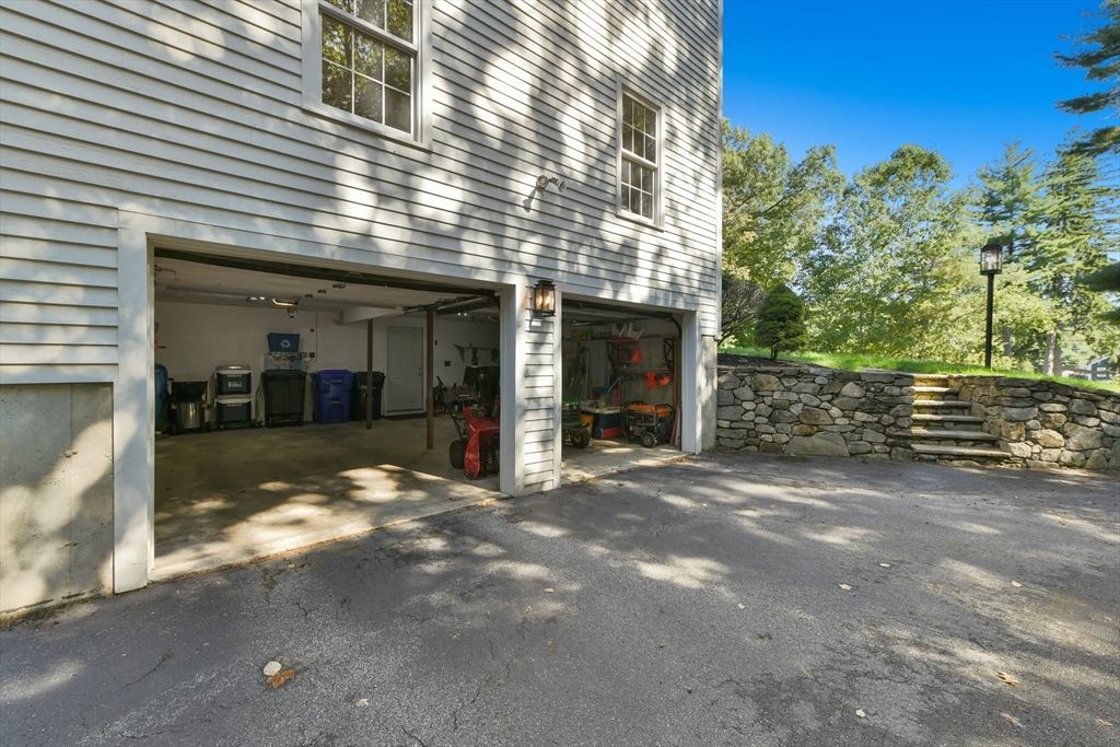 34 Valley Road Boxford, MA 01921 - Photo 40 of 42 a view of a house with a yard and garage