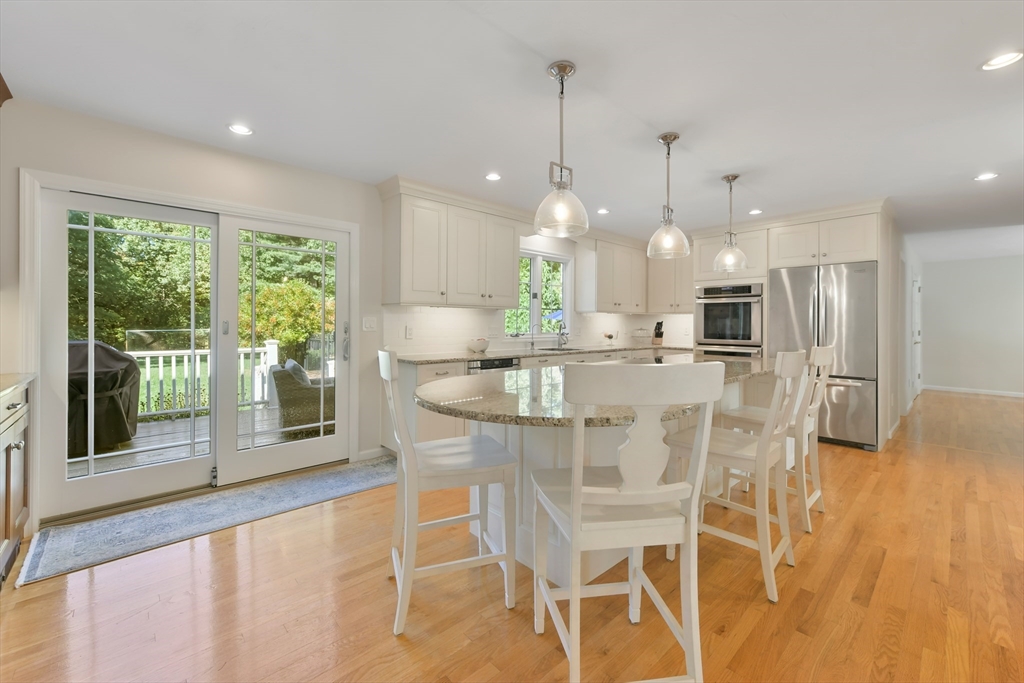 34 Valley Road Boxford, MA 01921 - Photo 4 of 42 a dining room filled with furniture and a floor to ceiling window
