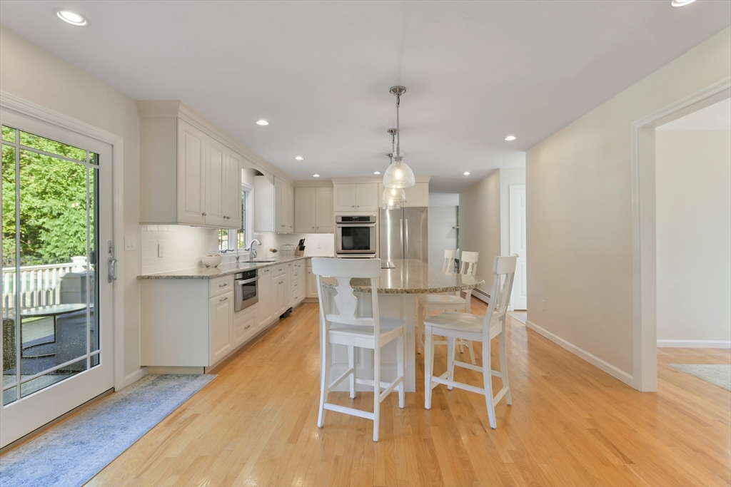 34 Valley Road Boxford, MA 01921 - Photo 5 of 42 a kitchen with stainless steel appliances granite countertop a stove top oven a sink refrigerator and cabinets