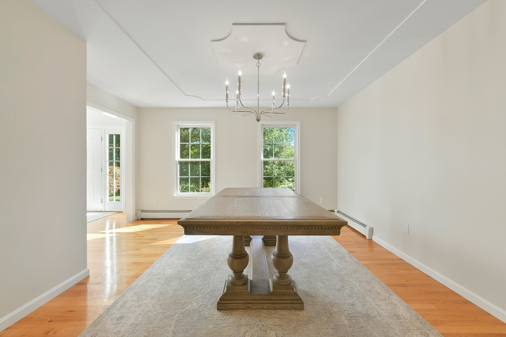 34 Valley Road Boxford, MA 01921 - Photo 6 of 42 a view of a room with a large window and chandelier