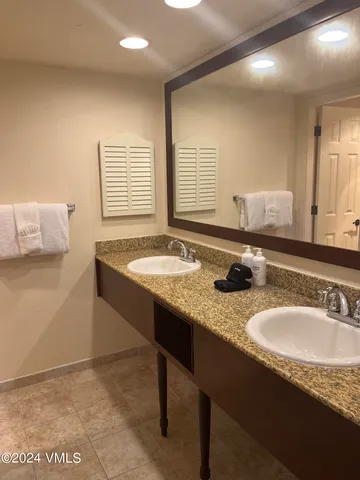 a bathroom with a tub and a shower