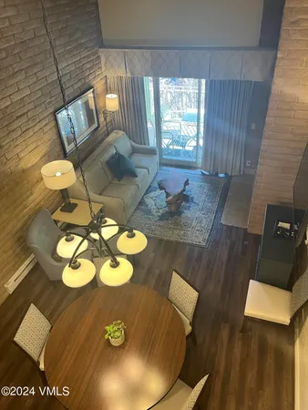 a view of a balcony with yard