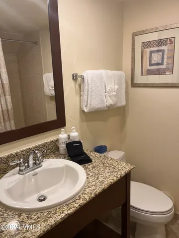 a bedroom with a bed window and couch