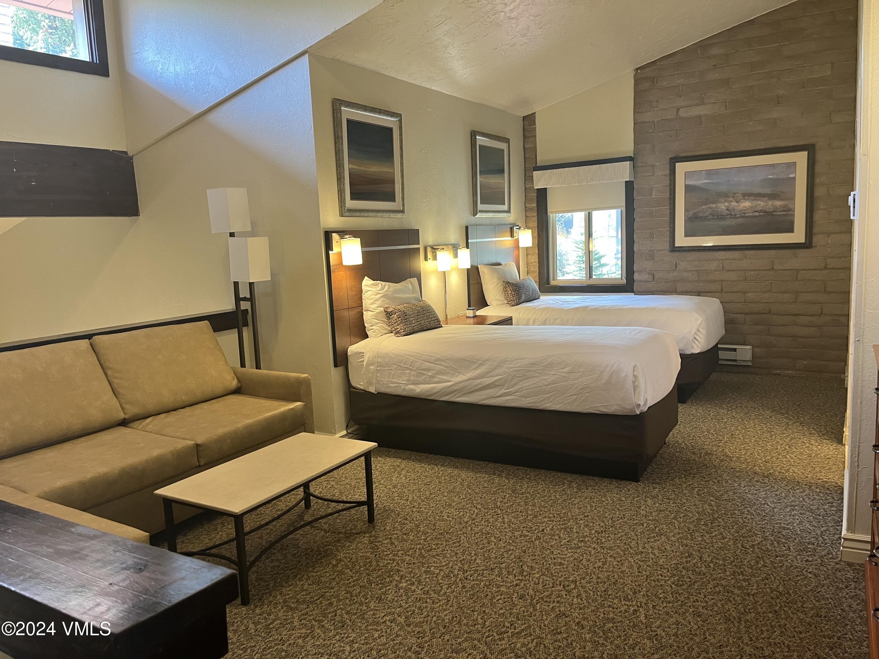 1020 Vail View Drive, Unit 340331 Vail, CO 81657 - Photo 10 of 25 a bedroom with a bed window and couch