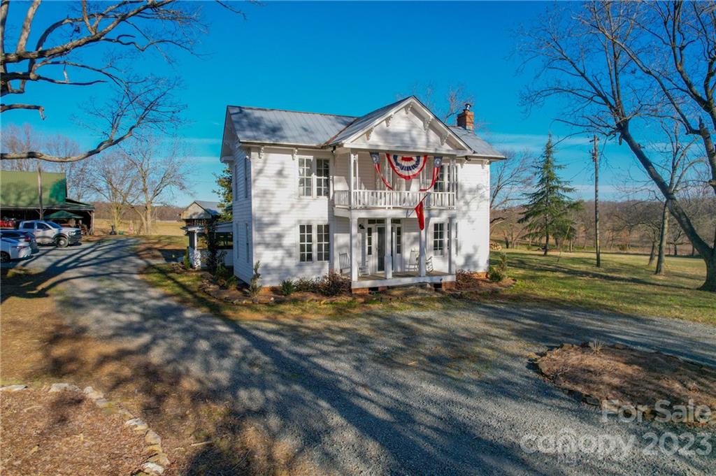 8689 Math Road Stanfield, NC 28163 - Photo 1 of 36 a front view of a house with a yard