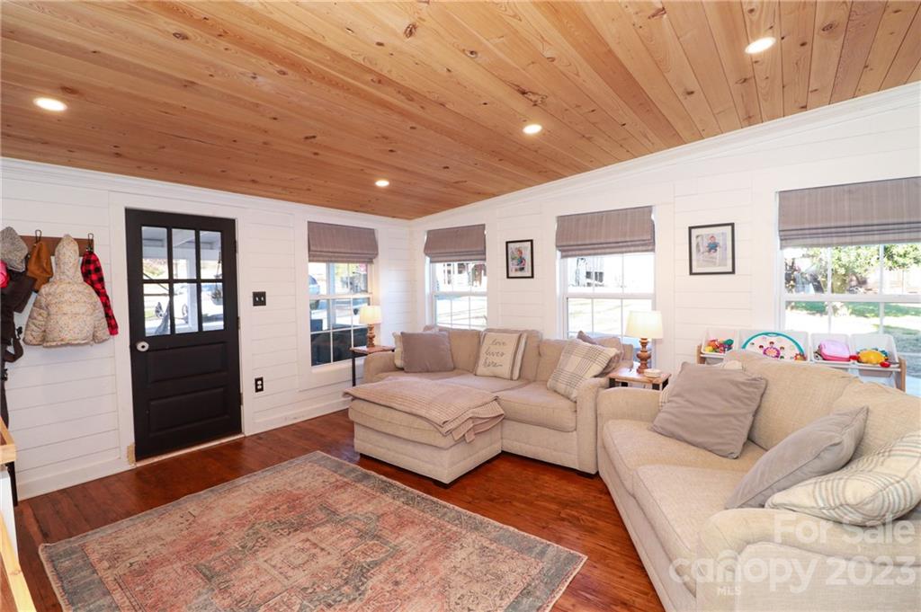 8689 Math Road Stanfield, NC 28163 - Photo 18 of 36 a living room with furniture and a wooden floor