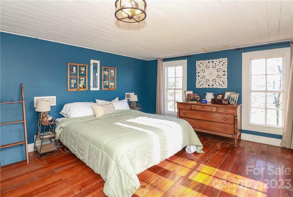 8689 Math Road Stanfield, NC 28163 - Photo 19 of 36 a bedroom with bed and window